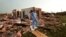  Nathan Ulepich searches outside the back of his house destroyed after a powerful tornado ripped through the area on May 20, 2013 in Moore, Oklahoma. 