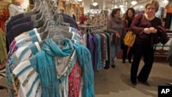 Shoppers look over the clothes at the Vermont Trading Company in Montpelier, Vermont, April 2013.