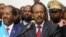 Somalia's newly elected President Mohamed Abdullahi Farmajo flanked by outgoing president Hassan Sheikh Mohamud (L) addresses lawmakers after winning the vote at the airport in Somalia's capital Mogadishu, Feb. 8, 2017.