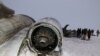 FILE - The wreckage of an airplane is seen after a crash in Deh Yak district of Ghazni province, Afghanistan, Jan. 27, 2020. 
