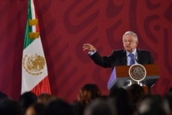 FILE - Mexican President Andres Manuel Lopez Obrador speaks during his daily morning press conference at the National Palace in Mexico City, Mexico, Nov. 21, 2019.