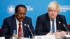 Britain's Foreign Secretary Boris Johnson listens during a National Security session as President of Somalia Mohamed Abdullahi Mohamed, left, speaks at the 2017 Somalia Conference in London, May 11, 2017. 