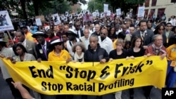 FILE - This June 17, 2012, photo shows Rev. Al Sharpton, center, with demonstrators during a silent march to end the "stop-and-frisk" program in New York.