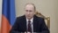 Russian President Vladimir Putin chairs a meeting with members of the Security Council at the Kremlin in Moscow, Russia, Jan. 22, 2016. 