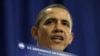 President Barack Obama holds up a chart as he speaks about his energy policies March 1, 2012 in Nashua, New Hampshire.
