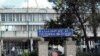 Pedestrians walk past the Federal High Court building in Addis Ababa