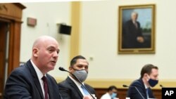  R. Clarke Cooper, Assistant Secretary of State for Political-Military Affairs, left, and other State Department officials testify on the firing of State Department Inspector General Steven Linick, Sept. 16, 2020, on Capitol Hill in Washington. 