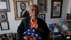 World War II veteran Johnnie Jones, Sr. poses for a portrait at his home in Baton Rouge, La., Tuesday, May 28, 2019. 