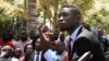 FILE - Ugandan musician-turned-politician Robert Kyagulanyi, also known as Bobi Wine, holds a news conference at his home near Kampala, Sept. 24, 2018. 
