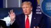 President Donald Trump flips through a stack of papers as he speaks about the coronavirus in the James Brady Press Briefing Room of the White House, in Washington, April 20, 2020.