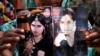 a family member shows pictures of slain fashion model Qandeel Baloch, in Shah Sadderuddin, Pakistan. 