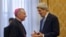 Secretary of State John Kerry (r) talks with Vatican Secretary of State Archbishop Pietro Parolin before the start of their meeting at the Apostolic Palace in the Vatican, Jan. 14, 2014. 