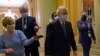 FILE - Senate Republican Majority Leader Mitch McConnell walks past reporters on Capitol Hill in Washington, Dec. 15, 2020. 