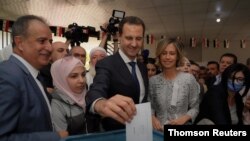 تصویر خبرگزاری دولتی سوریه از لحظه رای دادن بشار اسد