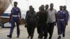 FILE - In this Feb. 22, 2016, photo, Nigeria naval officers escort arrested pirates that hijacked the Panama-flagged Maximus vessel.