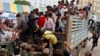 Cambodian migrant workers get off from a Thai truck upon their arrival from Thailand at a Cambodia-Thai international border gate in Poipet, Cambodia, Tuesday, June 17, 2014. 