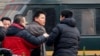 Zhang Xuezhong (C), a lawyer for Chinese dissident Zhao Changqing, argues with plain-clothed policemen as he refuses to show them his identification card when he was stopped and questioned by them on his way to court to attend Zhao's trial in Beijing, Jan. 23, 2014.