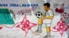 FILE - A mural depicting a soccer player is seen on a wall of a stadium in the Hodan district of Mogadishu, Somalia, June 13, 2017. 