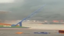 Magazin manifestan mete dife ladan yo nan Pòtoprens