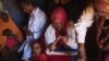 Medical practitioners attend to sick and malnourished children in the drought-stricken Baligubadle village near Hargeisa, the capital city of Somaliland, in this handout picture provided by The International Federation of Red Cross and Red Crescent Societ