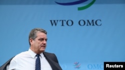 世界贸易组织(WTO)总干事阿泽维多于2019年12月9日抵达位于瑞士日内瓦的WTO总部参加总理事会。