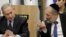 Israeli Prime Minister Benjamin Netanyahu listens to Israeli Interior Minister Aryeh Deri during a meeting with his nationalist allies and his Likud party members, at the Knesset, Israeli Parliament, in Jerusalem, March 4, 2020. 