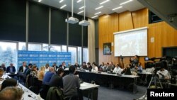 Mkutano wa wanasayansi na wataalam wa afya nchini Geneva uliojadili maambukizo ya kirusi corona, Geneva, Switzerland, Februari 11, 2020.REUTERS/Denis Balibouse