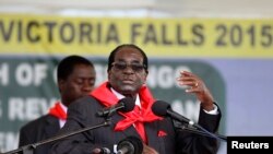 FILE: Zimbabwe President Robert Mugabe addresses people gathered for his 91st birthday celebration in Victoria Falls, Feb. 28, 2015. 