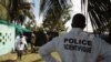 Forensic scientists and doctors prepare for the exhumation of a mass grave site on the grounds of a mosque, in the Yopougon district of Abidjan, Ivory Coast, April 4, 2013.