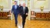 In this photo taken on Tuesday, Oct. 20, 2015, Russian President Vladimir Putin, right, and Syria President Bashar Assad arrive for their meeting in the Kremlin in Moscow, Russia. 