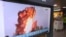 A TV screen shows a file image of a North Korea's missile launch during a news program at the Seoul Railway Station in Seoul, South Korea, Oct. 2, 2019. 