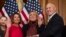 House Speaker Nancy Pelosi of Calif., right, poses during a ceremonial swearing-in with Rep. Pete Stauber, R-Minn., on Capitol Hill in Washington, Jan. 3, 2019, during the opening session of the 116th Congress.