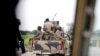 FILE - A Nigerian army convoy vehicle drives ahead with an anti-aircraft gun on its way to Bama, Borno State, Nigeria, Aug. 31, 2016.