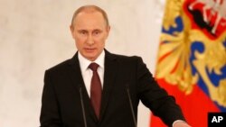 블라디미르 푸틴 러시아 대통령이 18일 모스크바에서 크림공화국 병합에 관한 입장을 밝히고 있다. 