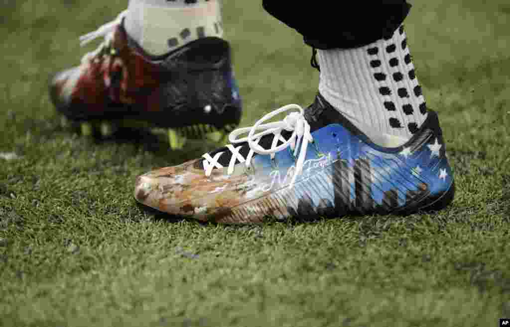 Atlanta Falcons wide receiver Julio Jones warms up wearing cleats in remembrance of 9/11 before the first half of an NFL football game in Atlanta, Georgia.