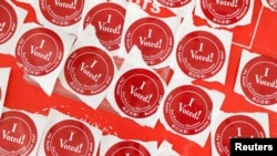 A table of “I voted!” stickers are seen at a polling station in San Francisco, California, March 3, 2020.