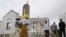 Worshipers arrive at Holy Trinity Catholic Church in Nigeria's capital, Abuja, June 24, 2012. 
