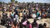 FILE - Some of more than 30,000 people who flocked into Leer town, South Sudan, to receive food from the International Committee of the Red Cross, Dec. 15, 2015, which marks the two-year anniversary of South Sudan's civil war. 