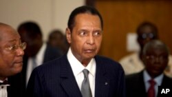 FILE - Former Haitian dictator Jean-Claude Duvalier attends his hearing at court in Port-au-Prince as authorities charged him with human rights abuses and embezzlement.