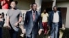 FILE - Maurice Kamto, a presidential candidate of Renaissance Movement (MRC), walks with his staff after his news conference at his headquarter in Yaounde, Cameroon, Oct. 8, 2018. 