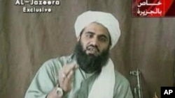 A street seller teaches a boy how to make soap bubbles, on Piazza del Popolo, a touristic square in central Rome, Italy, at sunset on July 2, 2015.