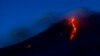 FILE - Mount Etna volcano spews lava during an eruption, Dec. 8, 2018. 