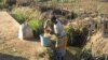 A woman gathers water in Malawi. A cholera outbreak that has hit the country is being linked to poor hygiene and untreated water. (L. Masina/VOA) 