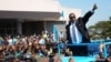 FILE - Newly elected Malawian president Peter Mutharika greets supporters after he was sworn in at the High Court in Blantyre, Malawi, May 31, 2014.