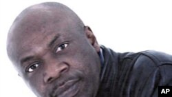 In this undated file photo provided by the militant group Movement for the Emancipation of the Niger Delta, militant leader Henry Okah poses for a photo. The ex-leader of a militant group that claimed responsibility for a dual car bombing that killed 12 i