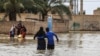 In this image shared on social media and verified by VOA Persian, a flash flood submerges buildings in western Iran’s Lorestan province, April 1, 2019. 