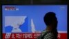 A man walks past a TV broadcasting a news report on North Korea's failed missile launch from its east coast, at a railway station in Seoul, South Korea, April 16, 2017. 