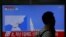 A man walks past a TV broadcasting a news report on North Korea's failed missile launch from its east coast, at a railway station in Seoul, South Korea, April 16, 2017. 