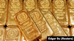 FILE - Gold bullions are displayed at GoldSilver Central's office in Singapore June 19, 2017. (REUTERS/Edgar Su/File Photo)
