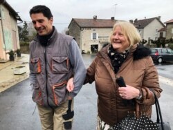 Briton Elaine Bastian walks with her husband, Chris, in the village of Blond, France, where they live and where she serves on the elected council, Jan. 28, 2020.